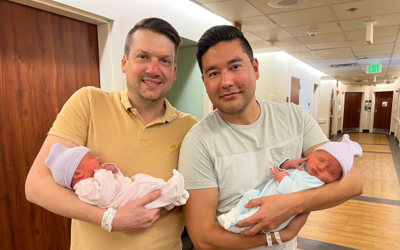 Image of Chris (left) and Bryan (right) with their twins, Brecon and London