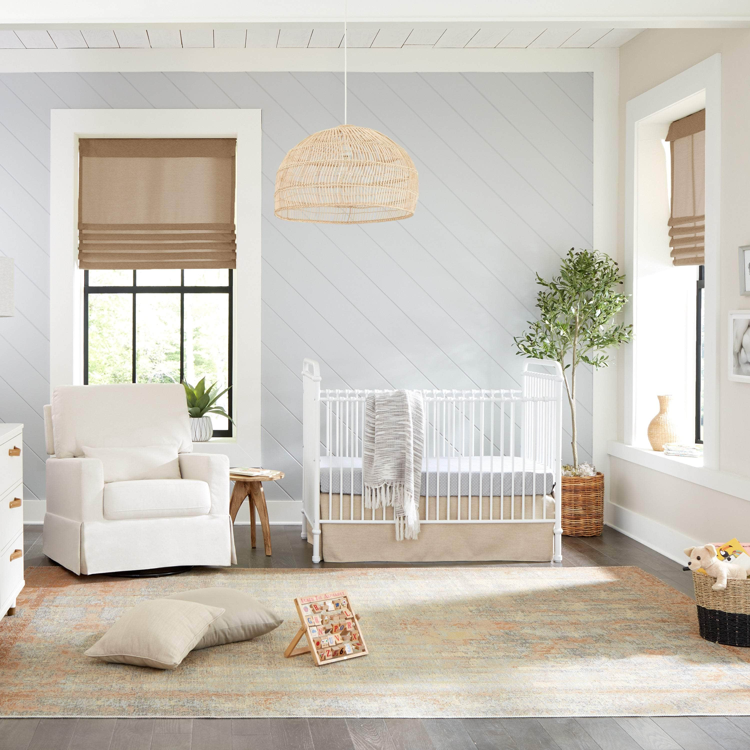 White crib with outlet wheels